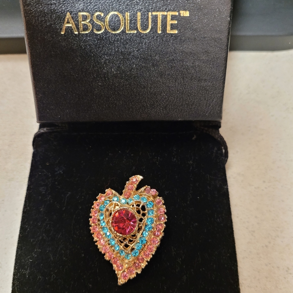 Woman's Absolutely Aqua,Pink,Ruby colored Pin. Pin comes in original box.